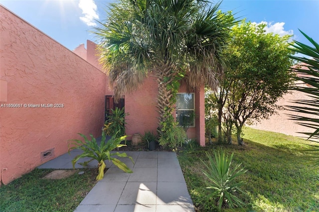1649 NW 56th Ter Unit 9, Lauderhill, FL 33313 - view of property exterior featuring stucco siding and a patio area