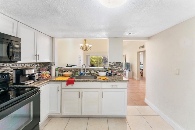 1649 NW 56th Ter Unit 9, Lauderhill, FL 33313 - kitchen with black appliances, a sink, tasteful backsplash, a chandelier, and white cabinetry