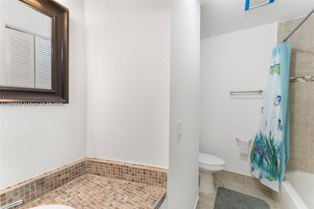 1649 NW 56th Ter Unit 9, Lauderhill, FL 33313 - full bath featuring tile patterned flooring, toilet, and shower / bath combo with shower curtain