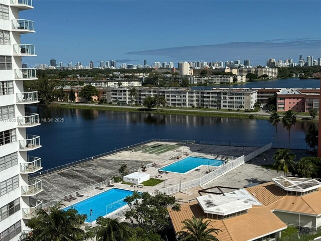 1301 NE Miami Gardens Dr Unit 1025W, Miami, FL 33179 - bird's eye view of a pool area, city skyline, and a large body of water