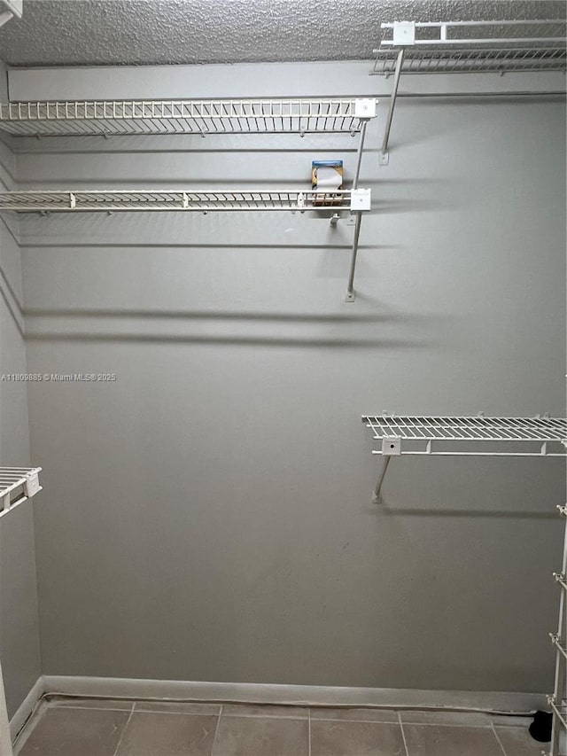 3300 Spanish Moss Ter Unit 210, Lauderhill, FL 33319 - walk in closet with tile patterned flooring