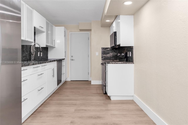 1904 S Ocean Dr Unit 1004, Hallandale Beach, FL 33009 - kitchen featuring a sink, white cabinets, appliances with stainless steel finishes, backsplash, and recessed lighting