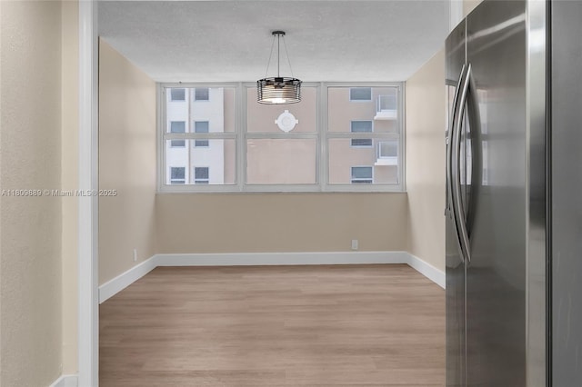1904 S Ocean Dr Unit 1004, Hallandale Beach, FL 33009 - unfurnished dining area featuring baseboards and light wood-style floors