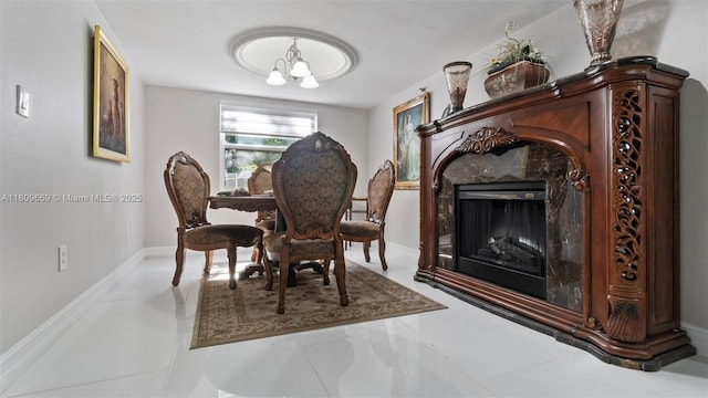 3910 Inverrary Blvd Unit 101-B, Lauderhill, FL 33319 - dining room featuring a chandelier, a premium fireplace, and baseboards