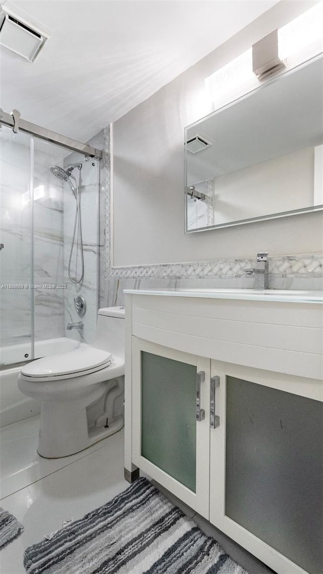 3910 Inverrary Blvd Unit 101-B, Lauderhill, FL 33319 - full bath with toilet, vanity, and shower / bath combination with glass door
