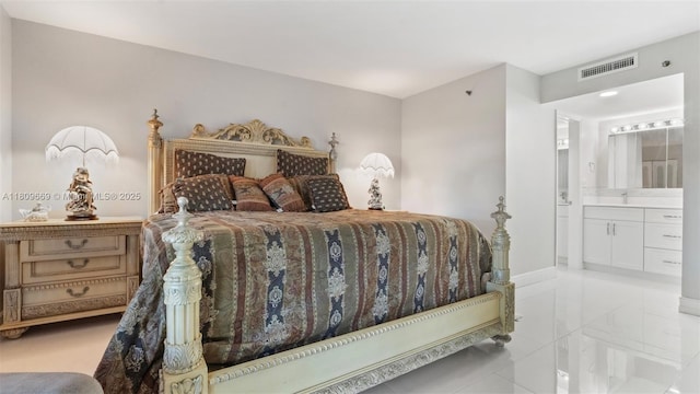 3910 Inverrary Blvd Unit 101-B, Lauderhill, FL 33319 - bedroom with ensuite bath and baseboards