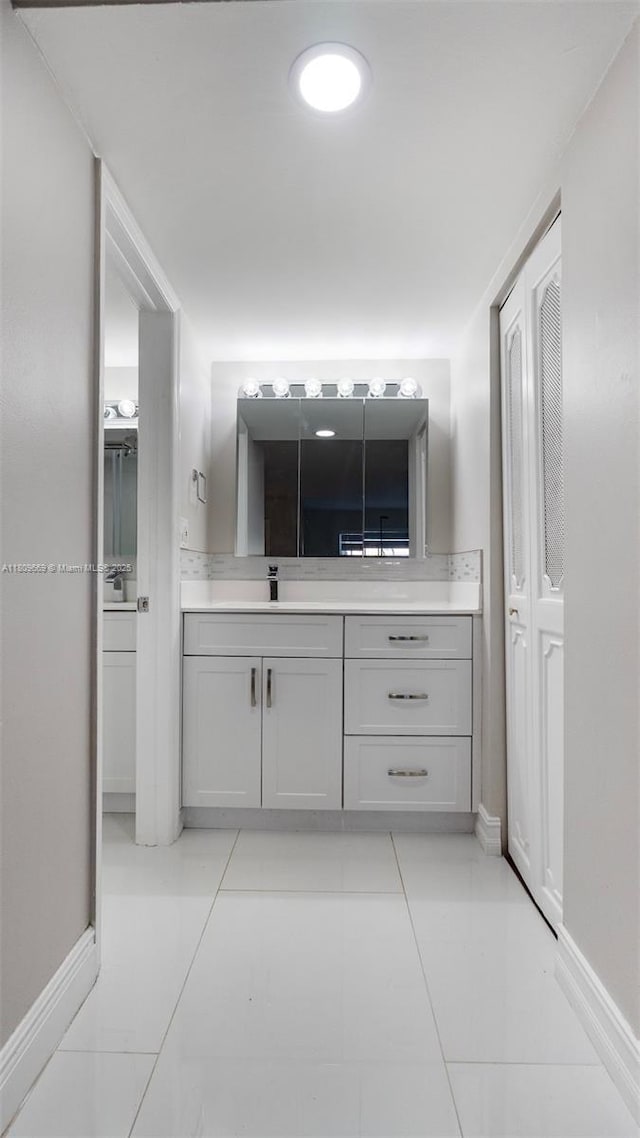 3910 Inverrary Blvd Unit 101-B, Lauderhill, FL 33319 - bathroom featuring vanity, tile patterned floors, and baseboards