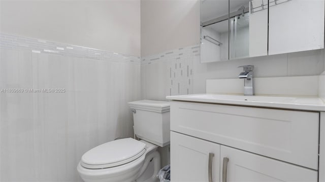 3910 Inverrary Blvd Unit 101-B, Lauderhill, FL 33319 - full bathroom with tile walls, vanity, toilet, and a shower