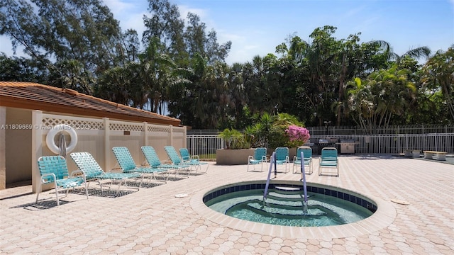 3910 Inverrary Blvd Unit 101-B, Lauderhill, FL 33319 - view of swimming pool featuring a community hot tub and a patio area