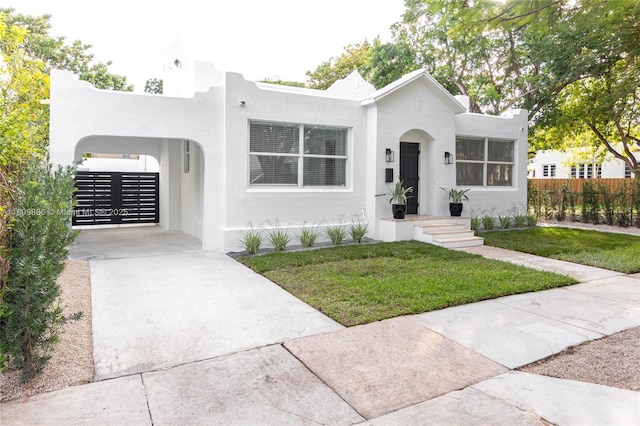 168 NE 47th St, Miami, FL 33137 - view of front of home with stucco siding and concrete driveway