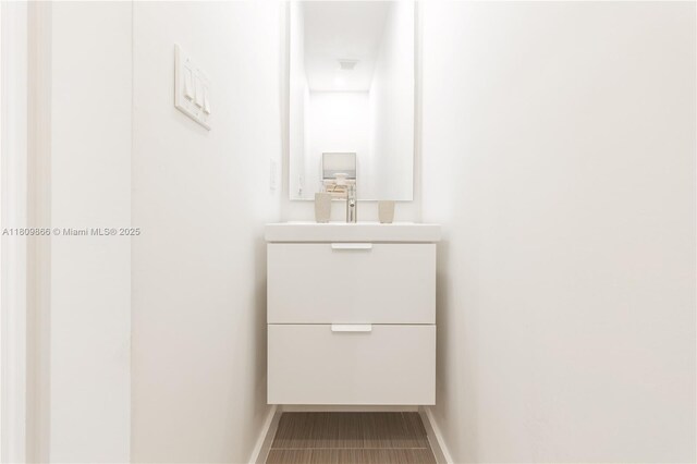 168 NE 47th St, Miami, FL 33137 - bathroom featuring baseboards and vanity