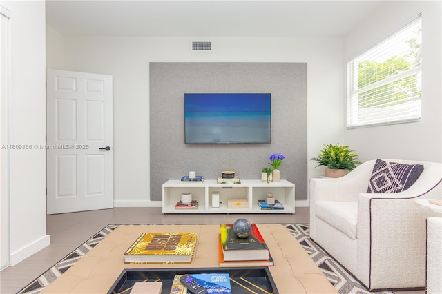 168 NE 47th St, Miami, FL 33137 - living area featuring baseboards and wood finished floors