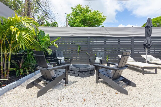 168 NE 47th St, Miami, FL 33137 - view of patio / terrace with a fire pit