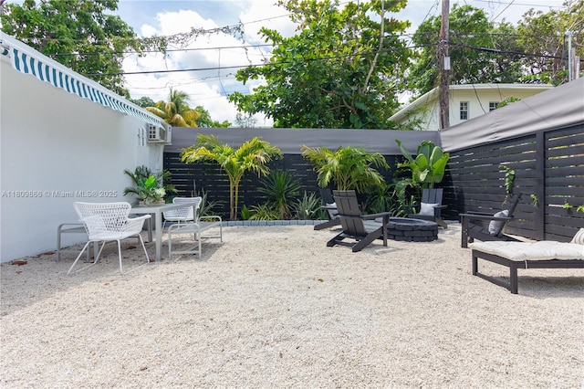 168 NE 47th St, Miami, FL 33137 - view of patio / terrace featuring outdoor dining space and an outdoor fire pit