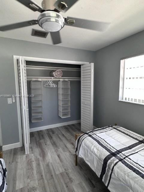 2359 Gabriel Ln, West Palm Beach, FL 33406 - bedroom with wood finished floors, a closet, and a ceiling fan