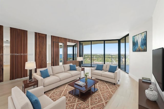 1000 Quayside Ter Unit 1909, Miami, FL 33138 - living area with a wall of windows and wood finished floors
