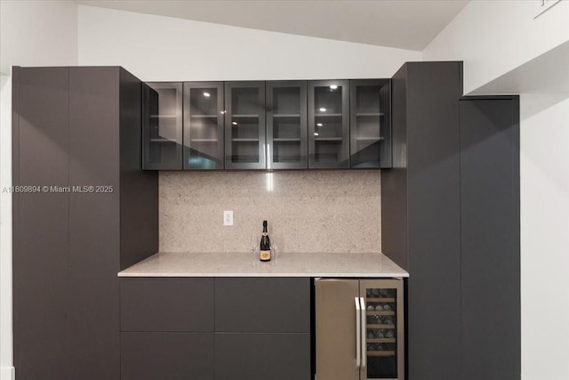 11505 NE 11th Pl, Biscayne Park, FL 33161 - bar area with beverage cooler, backsplash, and lofted ceiling