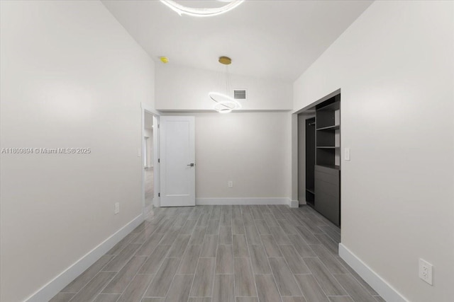11505 NE 11th Pl, Biscayne Park, FL 33161 - spare room with baseboards and wood finished floors