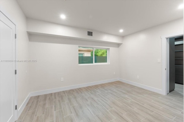 11505 NE 11th Pl, Biscayne Park, FL 33161 - empty room with light wood-style floors, baseboards, and recessed lighting
