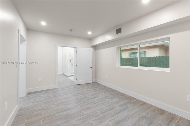 11505 NE 11th Pl, Biscayne Park, FL 33161 - spare room with baseboards, recessed lighting, and light wood-type flooring