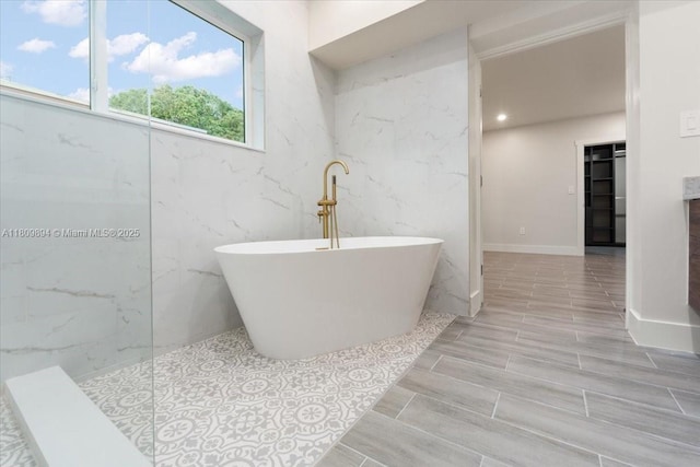 11505 NE 11th Pl, Biscayne Park, FL 33161 - bathroom featuring a soaking tub, wood tiled floors, and walk in shower