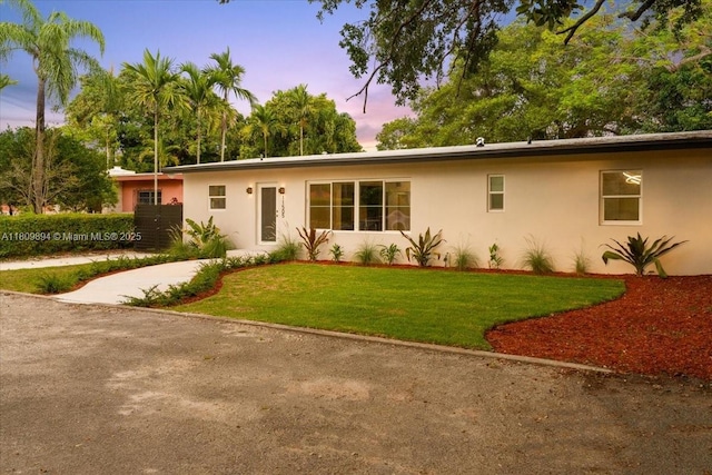 11505 NE 11th Pl, Biscayne Park, FL 33161 - single story home featuring stucco siding and a lawn