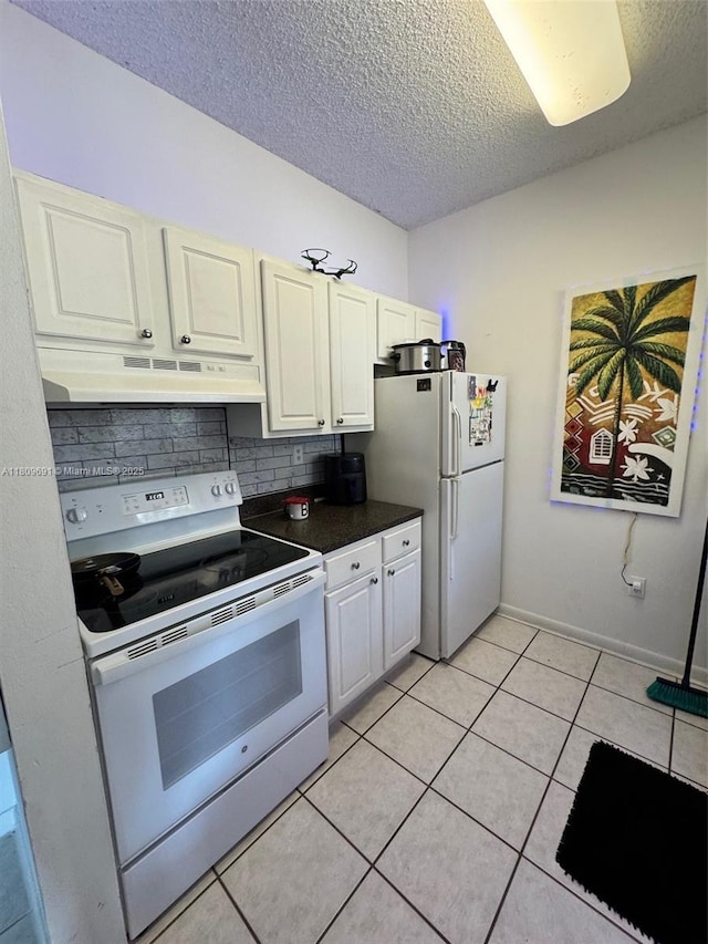 2151 NW 96th Ter Unit 15G, Pembroke Pines, FL 33024 - kitchen featuring white appliances, under cabinet range hood, a textured ceiling, backsplash, and light tile patterned floors