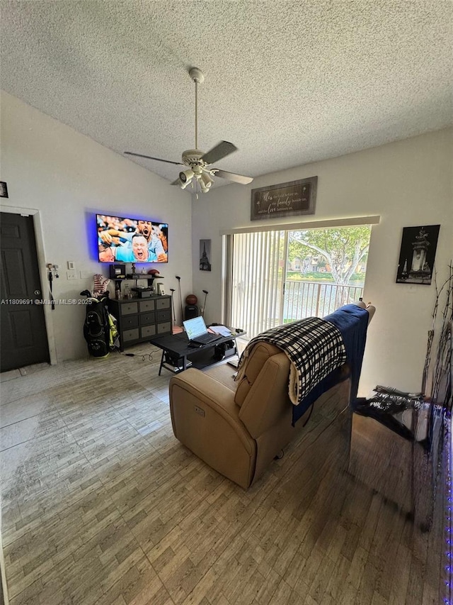 2151 NW 96th Ter Unit 15G, Pembroke Pines, FL 33024 - living area with a textured ceiling, a ceiling fan, and wood finished floors