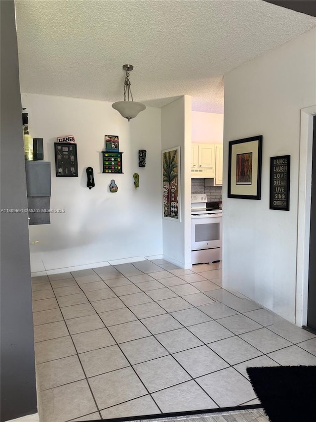 2151 NW 96th Ter Unit 15G, Pembroke Pines, FL 33024 - unfurnished room featuring a textured ceiling and light tile patterned flooring