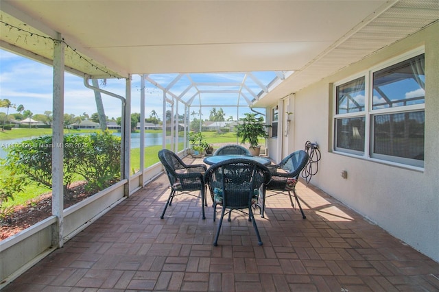 2597 SE 7th Ct, Homestead, FL 33033 - sunroom / solarium with a water view and outdoor dining area