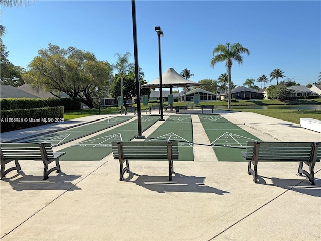 2597 SE 7th Ct, Homestead, FL 33033 - surrounding community with shuffleboard, a gazebo, and a yard