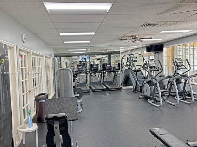 2597 SE 7th Ct, Homestead, FL 33033 - gym with a drop ceiling, a ceiling fan, and french doors