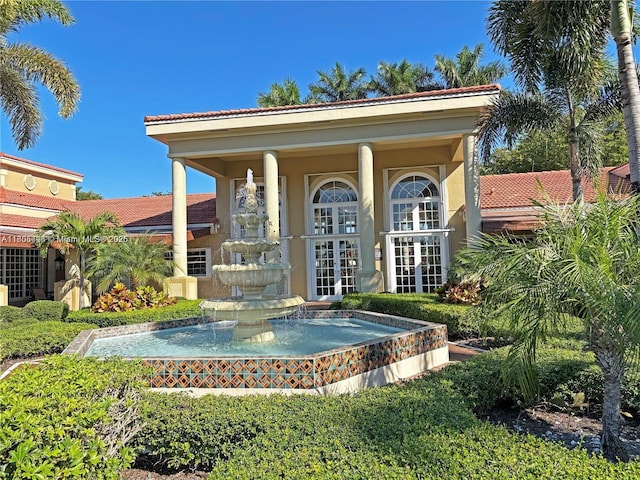 2597 SE 7th Ct, Homestead, FL 33033 - view of front of house with french doors, stucco siding, and a tile roof