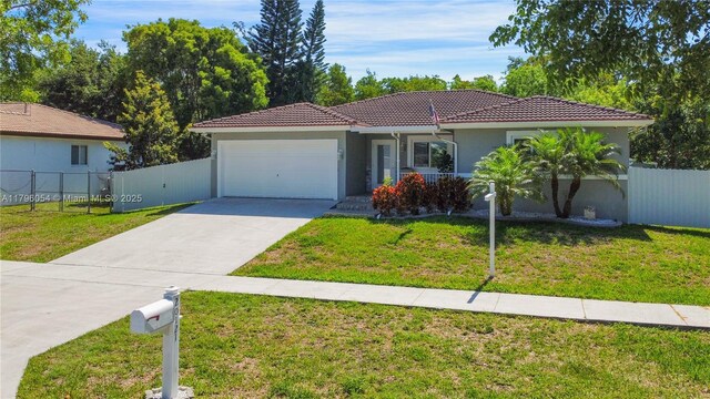 20121 SW 79th Ave, Cutler Bay, FL 33189 - view of front facade featuring a tile roof, an attached garage, concrete driveway, and stucco siding