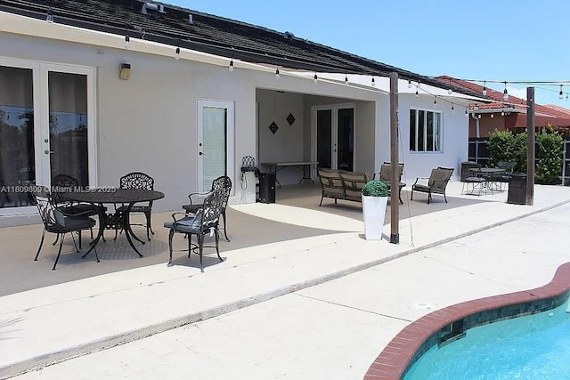 16272 SW 42nd Ter, Miami, FL 33185 - rear view of property with french doors, stucco siding, and a patio