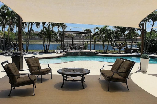 16272 SW 42nd Ter, Miami, FL 33185 - outdoor pool featuring a patio area and a water view