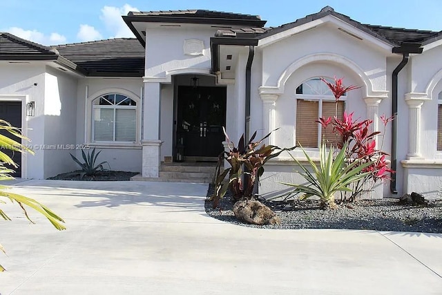 16272 SW 42nd Ter, Miami, FL 33185 - entrance to property featuring a tiled roof and stucco siding