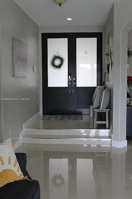 16272 SW 42nd Ter, Miami, FL 33185 - tiled foyer entrance featuring baseboards