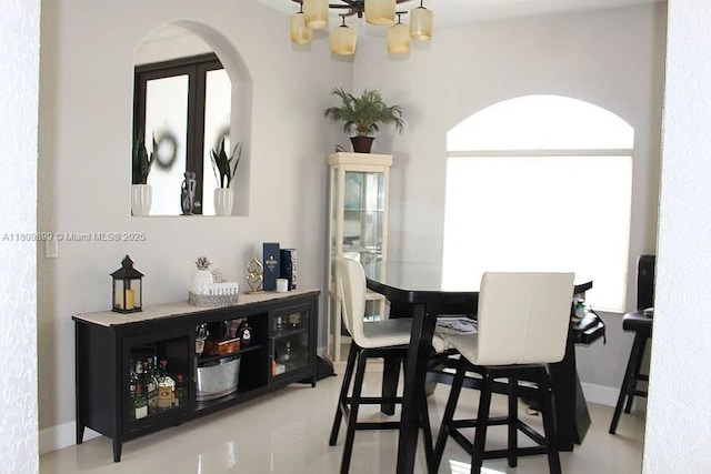 16272 SW 42nd Ter, Miami, FL 33185 - dining space featuring a chandelier and arched walkways