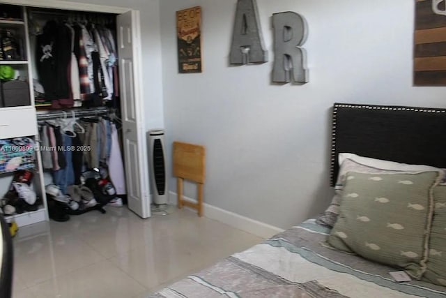 16272 SW 42nd Ter, Miami, FL 33185 - tiled bedroom featuring a closet and baseboards