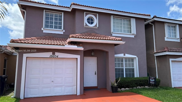 10054 SW 163rd Ct, Miami, FL 33196 - view of front of property with an attached garage, stucco siding, and a tiled roof