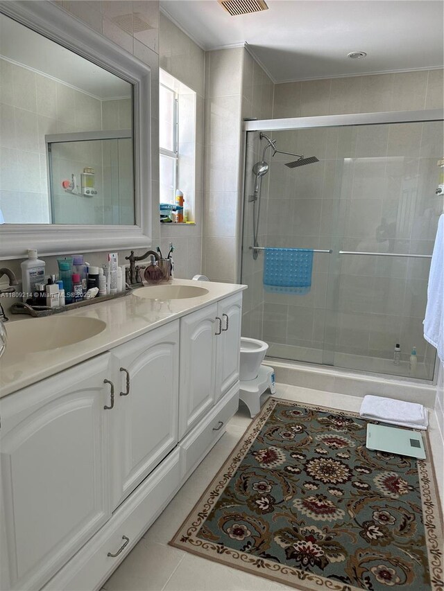 10054 SW 163rd Ct, Miami, FL 33196 - bathroom with double vanity, a shower stall, toilet, and ornamental molding