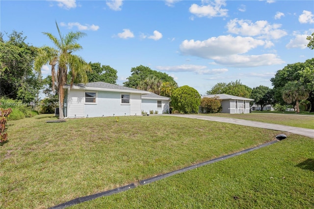 2330 SW Lejune St, Port St Lucie, FL 34953 - ranch-style home featuring driveway and a front yard