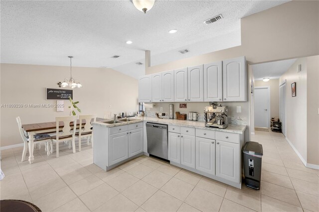 2330 SW Lejune St, Port St Lucie, FL 34953 - kitchen featuring dishwasher, a sink, a textured ceiling, a peninsula, and a chandelier