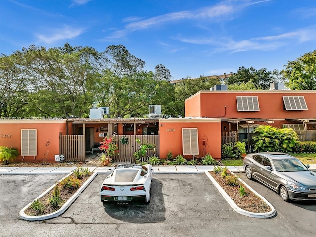 1489 Fairway Rd, Pembroke Pines, FL 33026 - view of front of house featuring uncovered parking and stucco siding