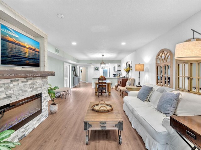 1489 Fairway Rd, Pembroke Pines, FL 33026 - living room with a fireplace, wood finished floors, and recessed lighting