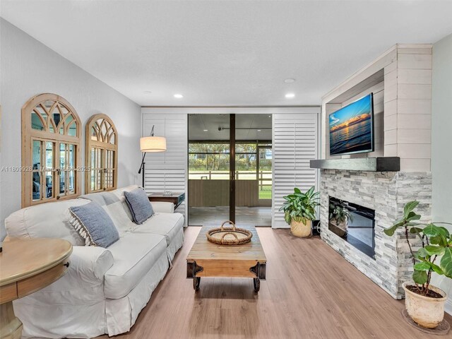 1489 Fairway Rd, Pembroke Pines, FL 33026 - living area featuring wood finished floors, a fireplace, and recessed lighting