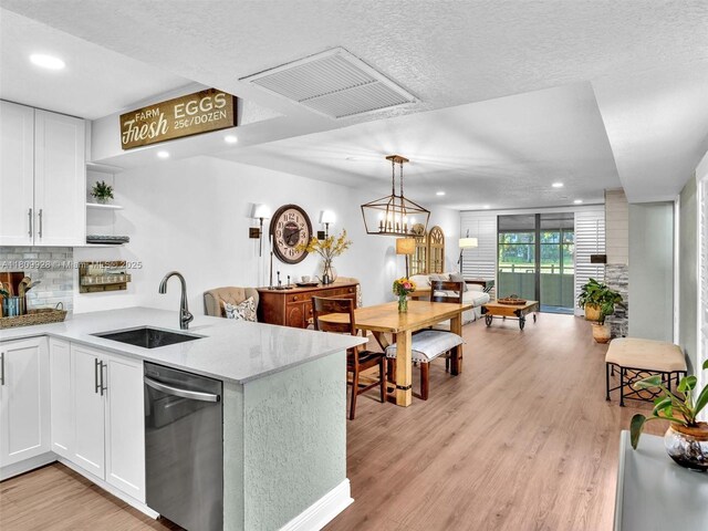 1489 Fairway Rd, Pembroke Pines, FL 33026 - kitchen with dishwasher, a sink, a peninsula, white cabinetry, and recessed lighting