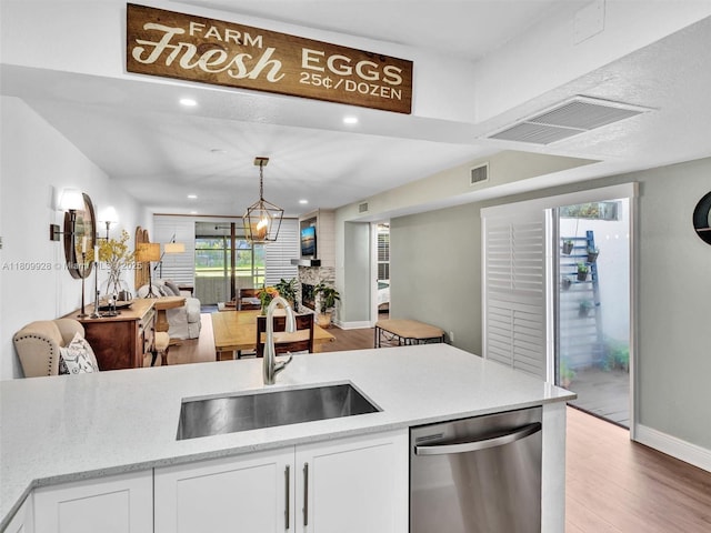 1489 Fairway Rd, Pembroke Pines, FL 33026 - kitchen featuring dishwasher, a sink, light wood-style floors, open floor plan, and recessed lighting
