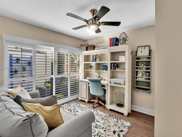1489 Fairway Rd, Pembroke Pines, FL 33026 - office with wood finished floors, a ceiling fan, baseboards, and a textured ceiling